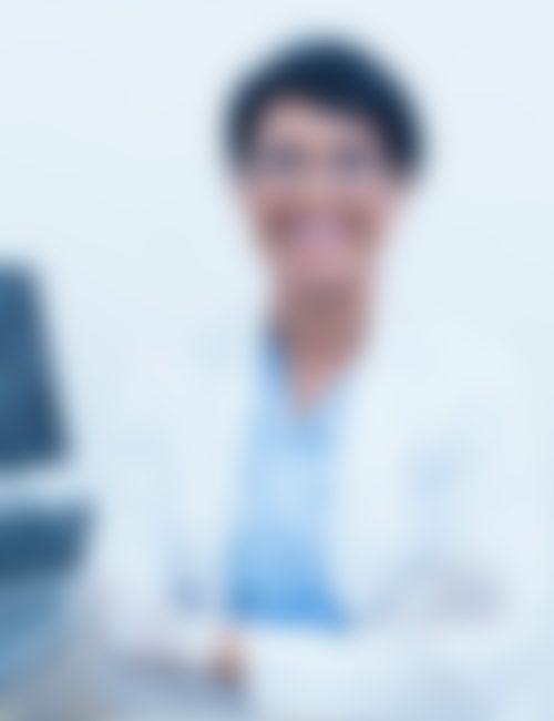 Portrait of smiling female dentist with arms crossed